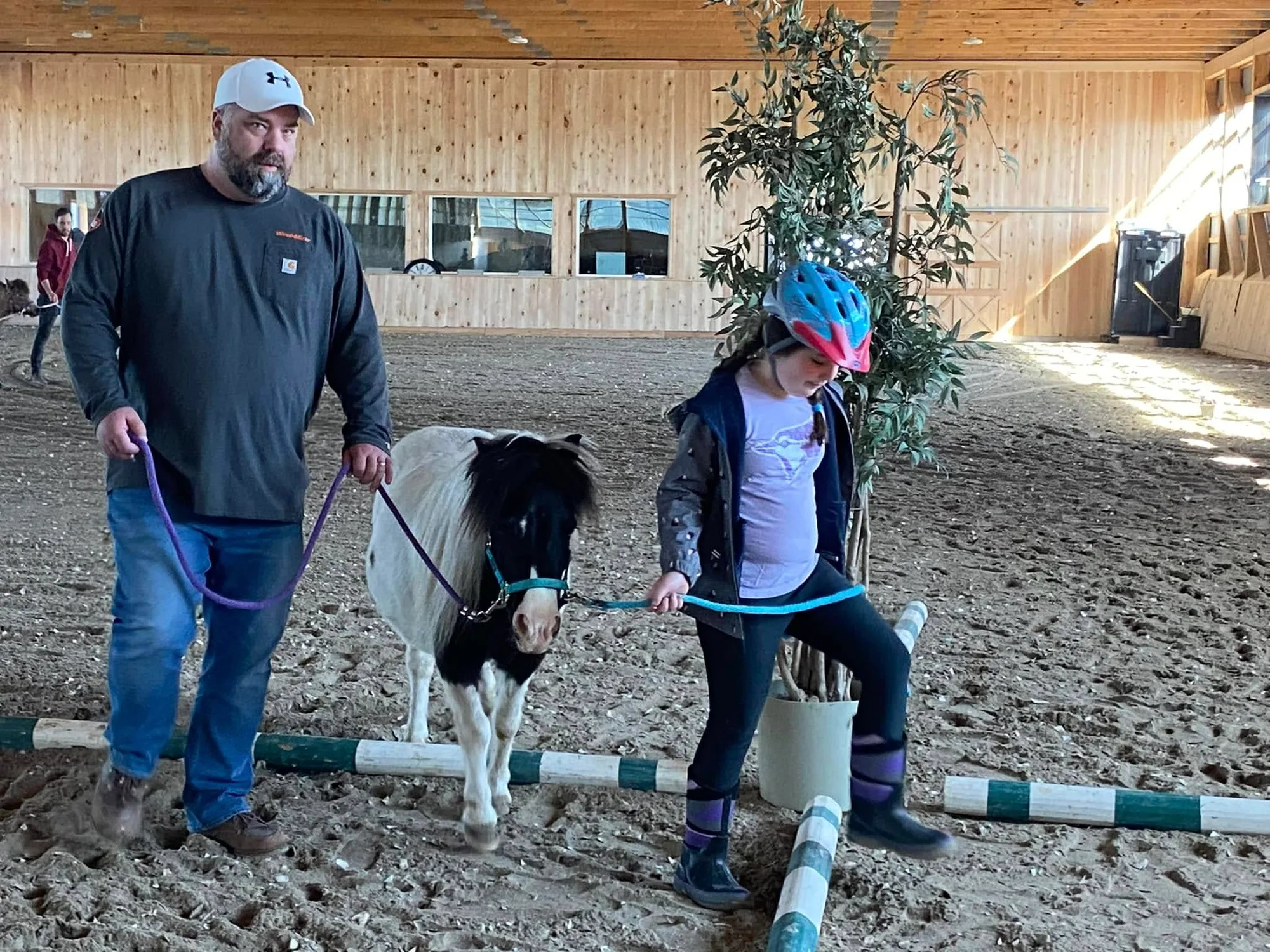 Family moment with a miniature horse